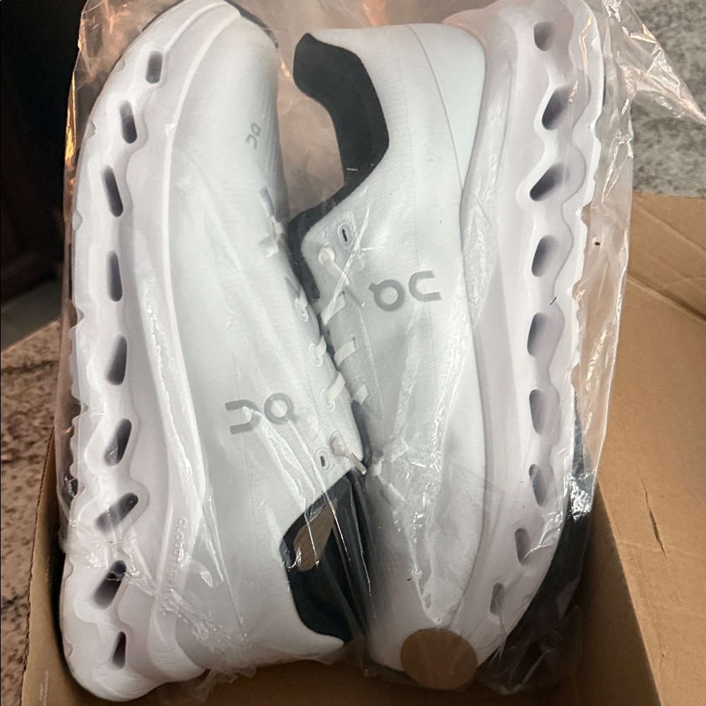 On Running Men's White and Black Athletic Shoes